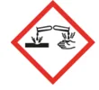 Pictogramme de danger en losange à bord rouge : un liquide qui coule de deux tubes à essai et attaque une surface et une main.